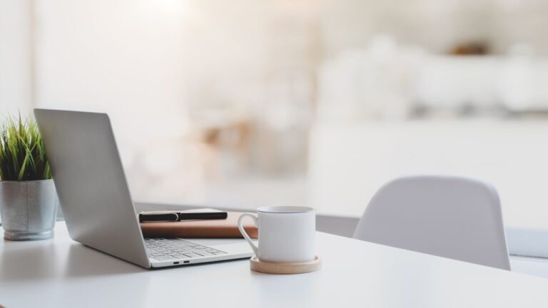 office desk laptop and coffee cup