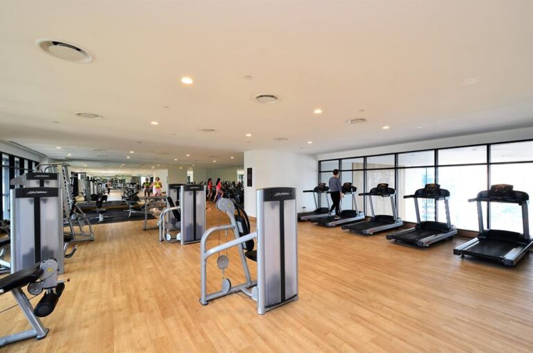 fitness center space with equipment showing porper cleaning