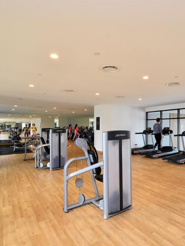 fitness center space with equipment showing porper cleaning