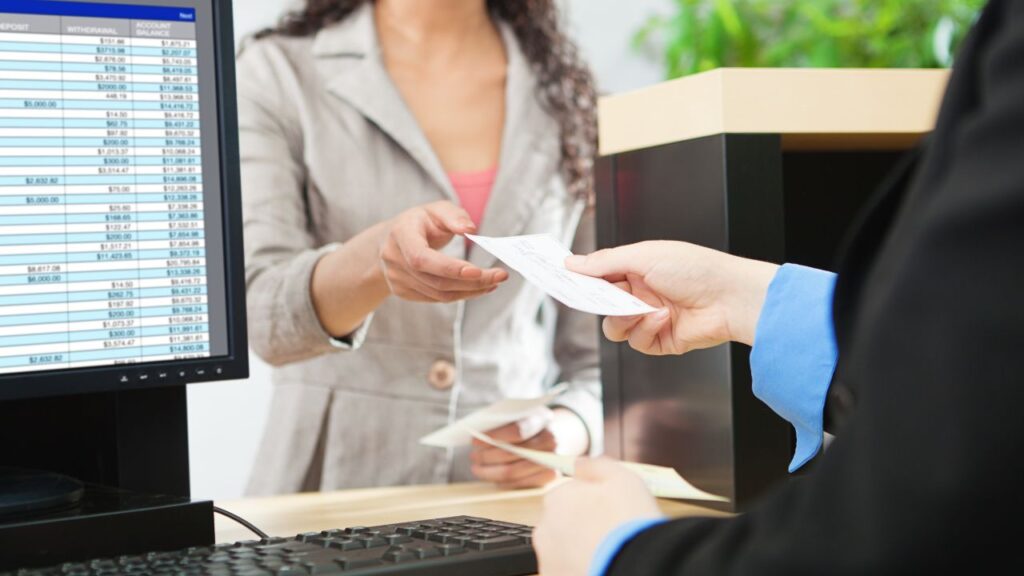 woman receiving a ticket at the bank