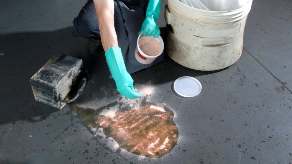 person with the proper clothes cleaning up a hazardous spill in the office