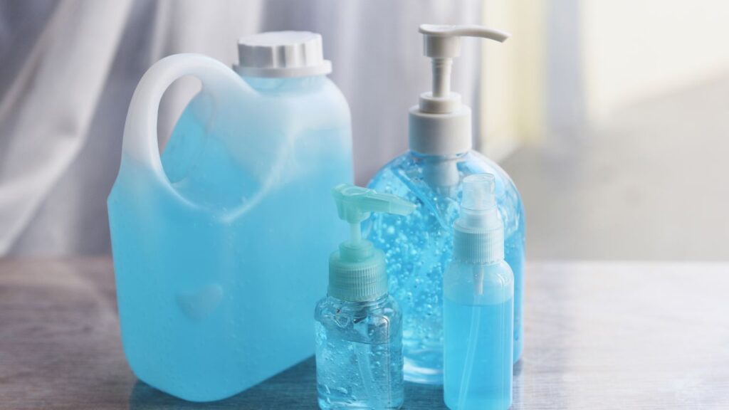 containers of different shapes and sizes with blue cleaning substance