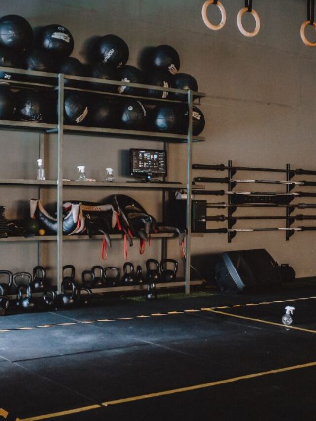 a crossfit gym space with mats, weights and other equipment