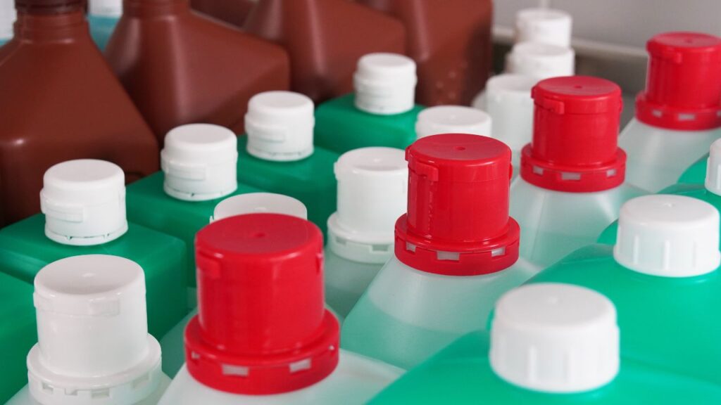tops of bottles of disifectants and sanitizers lined up