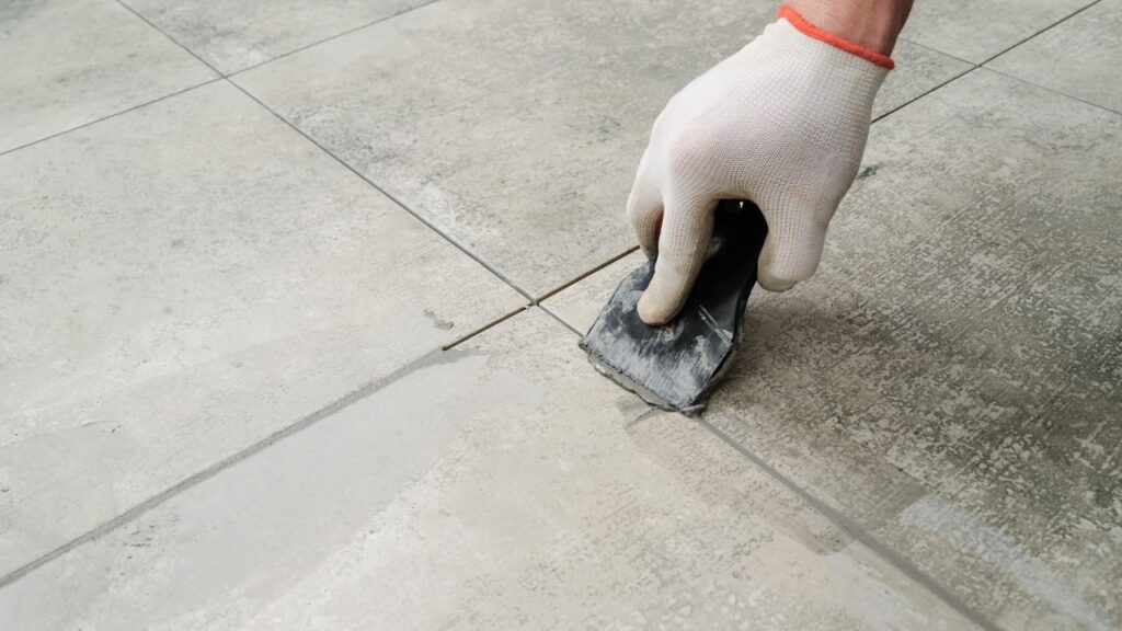 tile floor being sealed after being power washed