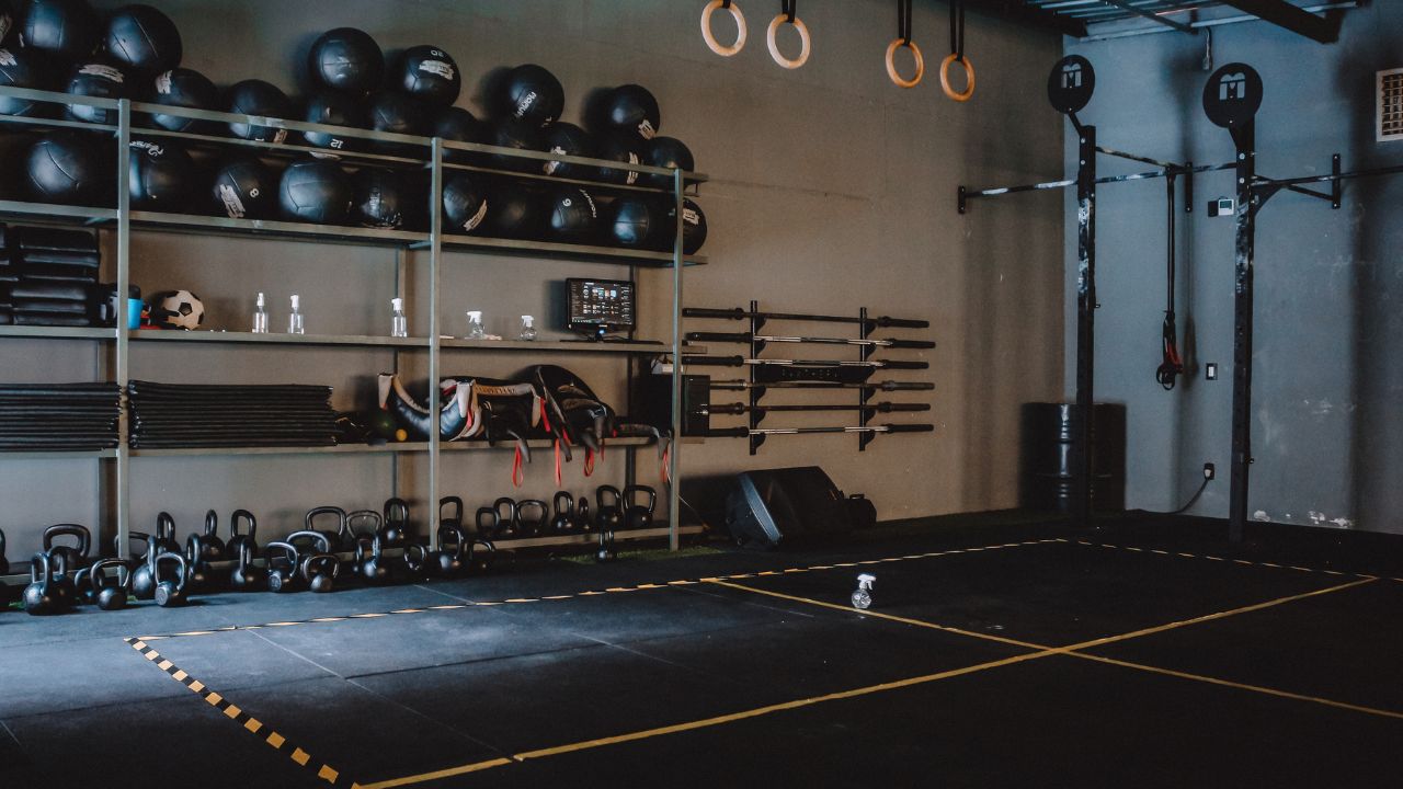 a crossfit gym space with mats, weights and other equipment