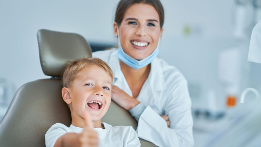 smiling-kid-with-dentist