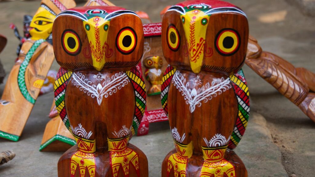 two colorful wood sculpted owels