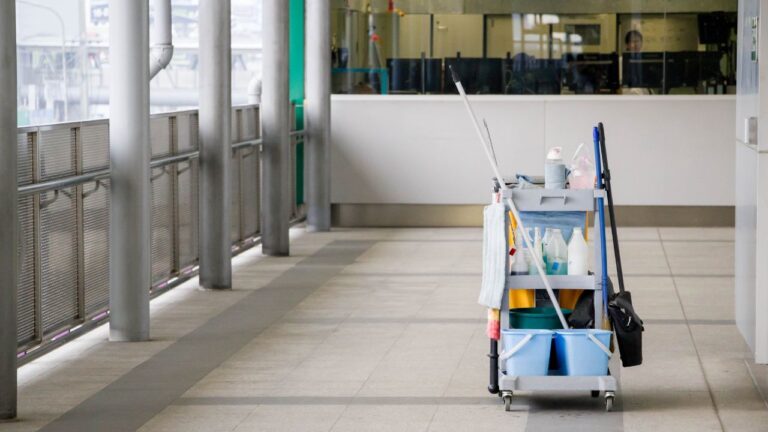 image of a porter service cleaning cart on a corridor of an office building