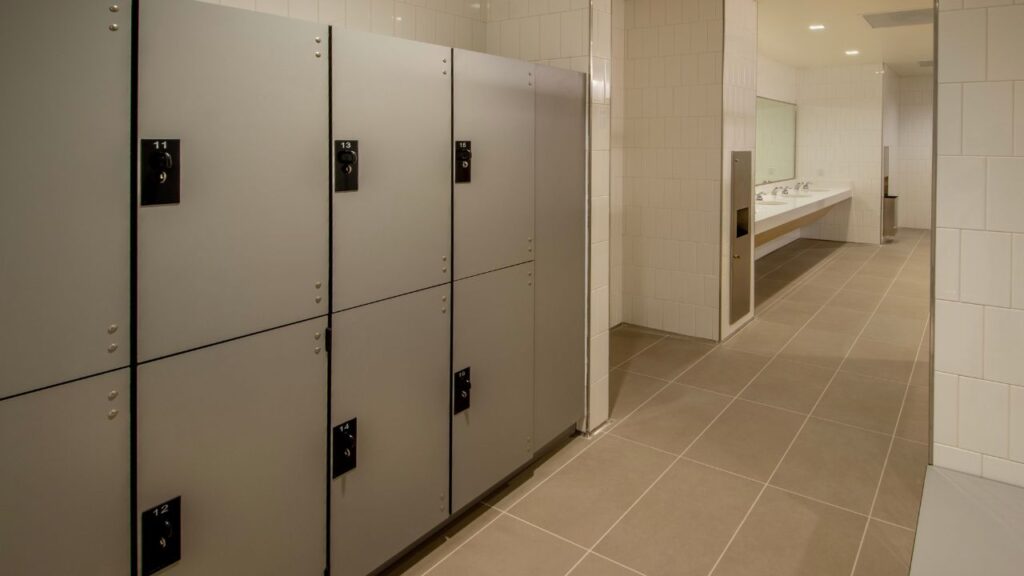 gym locker room with a sink and a few lockers