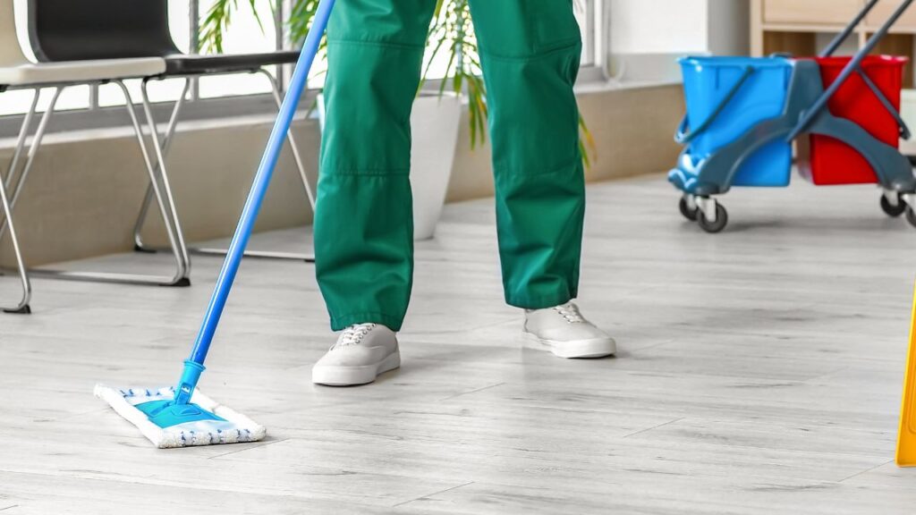 male-cleaning-staff-mopping-the-floor