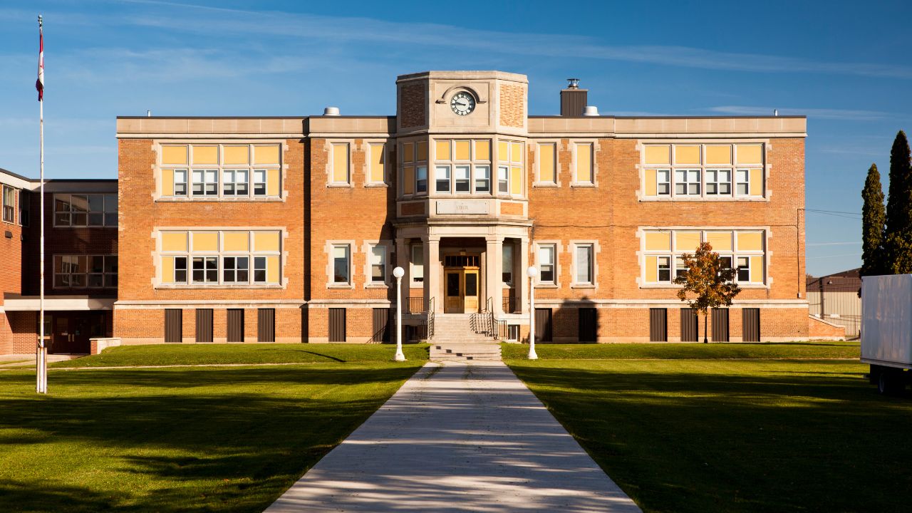 front of a school building in New York