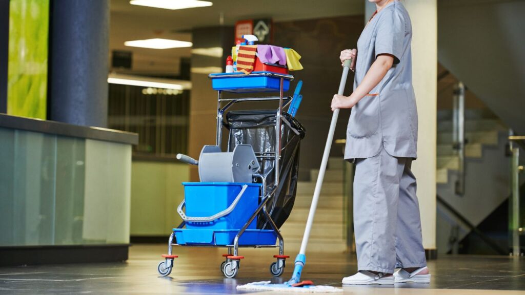 cleaning staff with cleaning cart