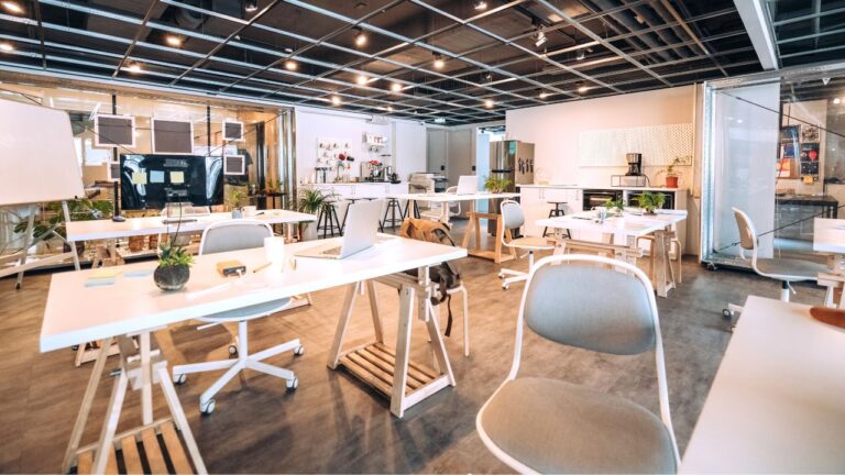 coworking space white desks and white and gray chairs